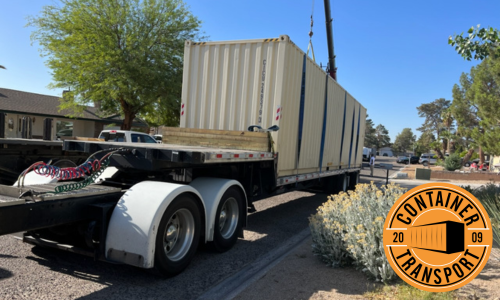 Transporting a container on a trailer.