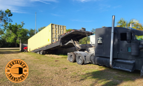 Putting a container on a trailer.