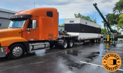 Shipping Container lifted by Crane onto Trailer.