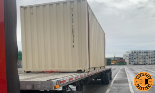 Transporting a 20ft container on a Flatbed trailer.