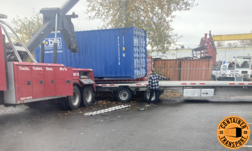 Crane loading a Container on a trailer.