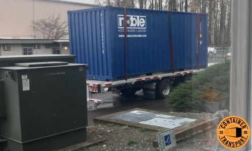 Container on a Trailer for transport.